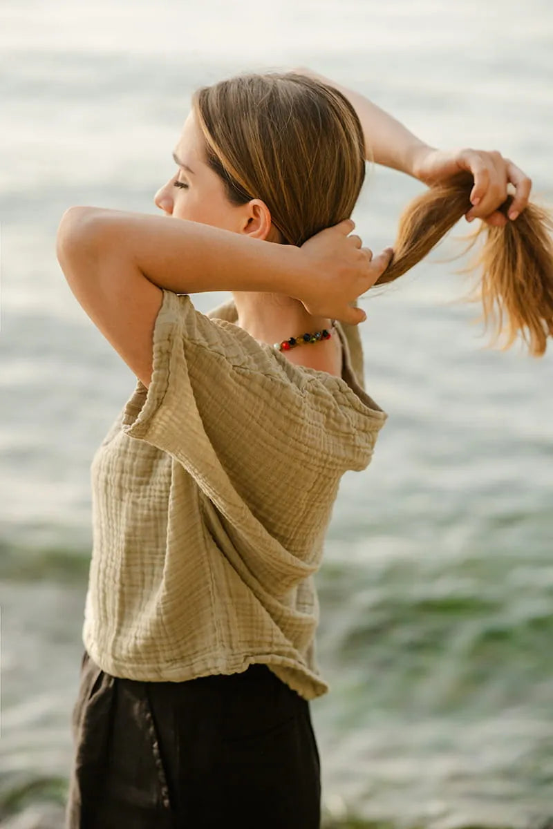 Woman wearing green double gauze cotton top