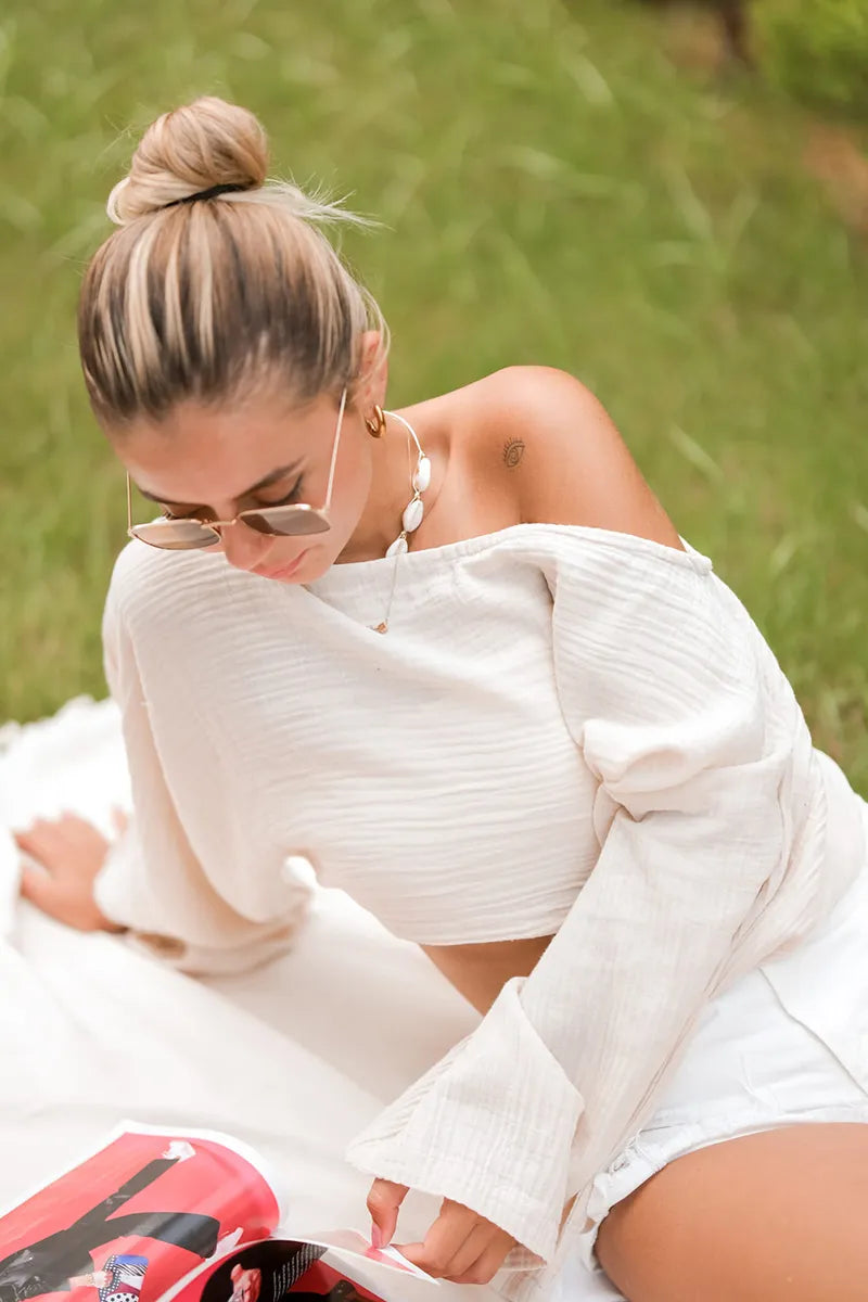 woman wearing double gauze cotton off the shoulder beige blouse