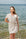 Woman in a Linen Wrap Dress standing by the ocean