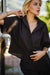 Front detail of the black linen cropped shirt — soft drape and breathable linen weave