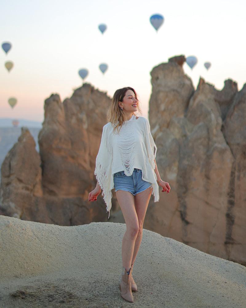 woman wearing top with fringe detail