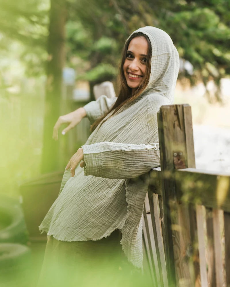Woman in green hooded robe 