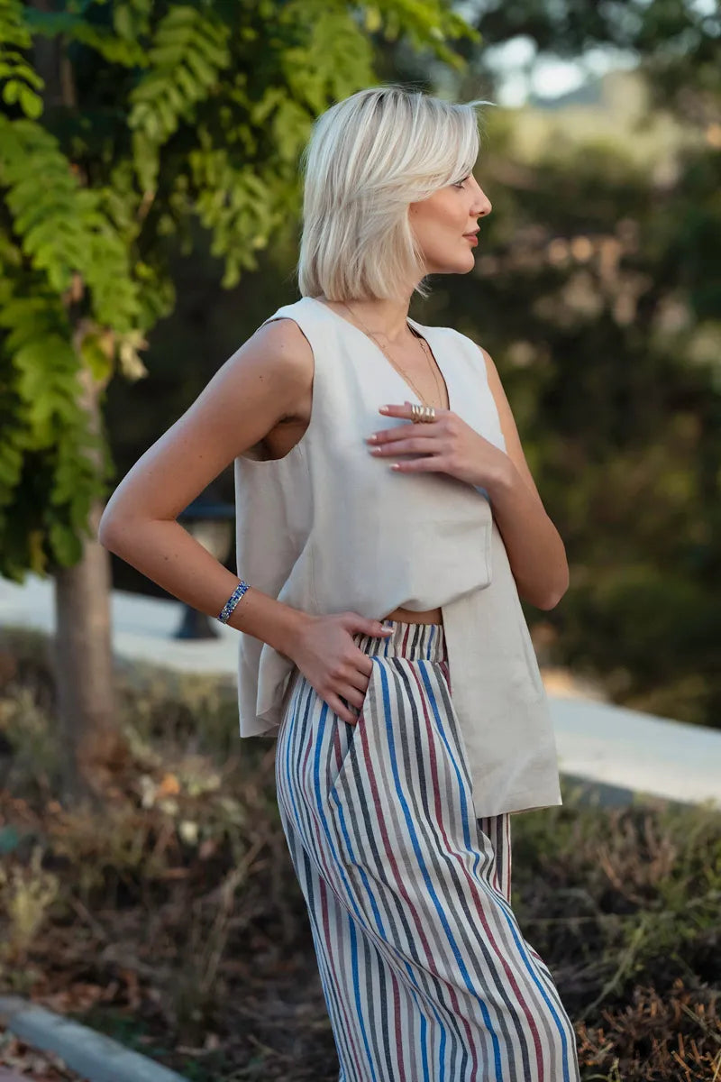 Back view of linen multi stripe wide leg palazzo pants showing wide leg silhouette
