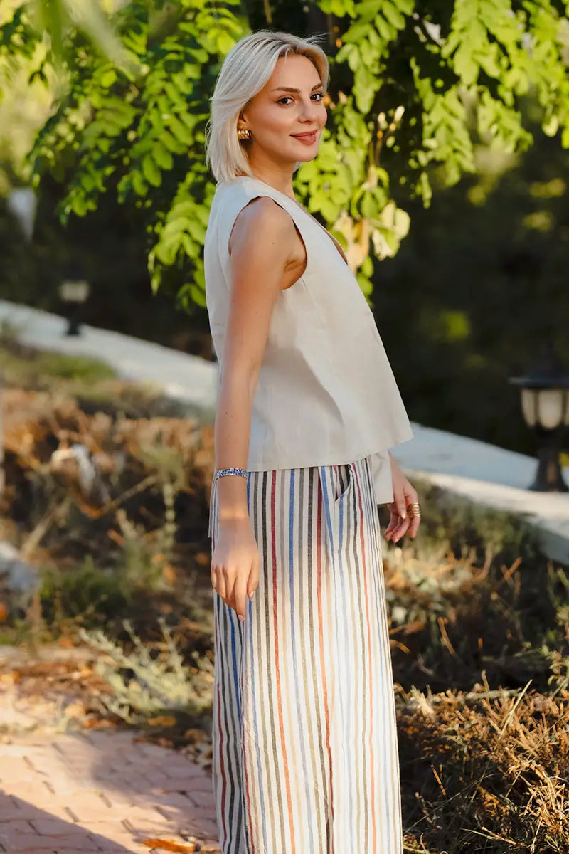 Detail of pull on elastic waist on linen multi stripe wide leg palazzo pants