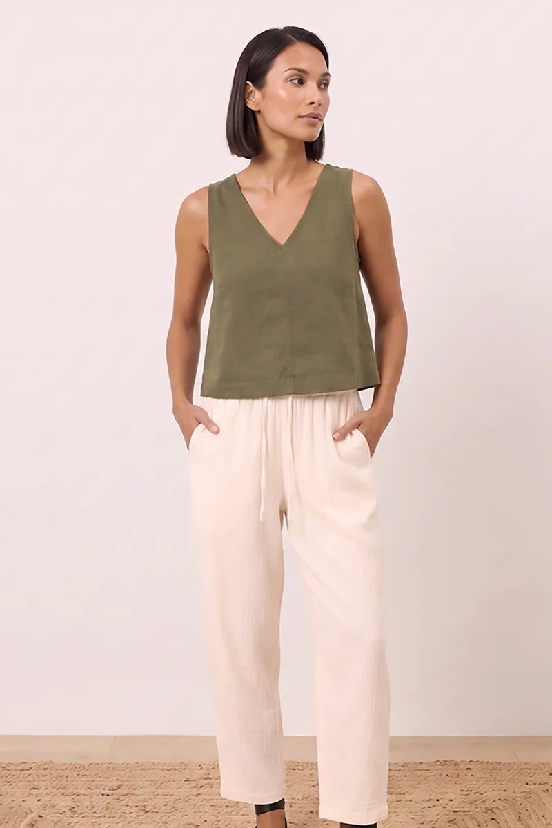 Model wearing the olive green linen wide strap tank top in a relaxed boxy silhouette