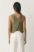 Back view of the olive green cross back tank top showing the crossed linen panels and open back