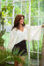 White linen poncho blouse with wide long sleeves and relaxed drape