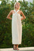 Striped halter neck midi dress outdoors among greenery — soft muslin cotton drape