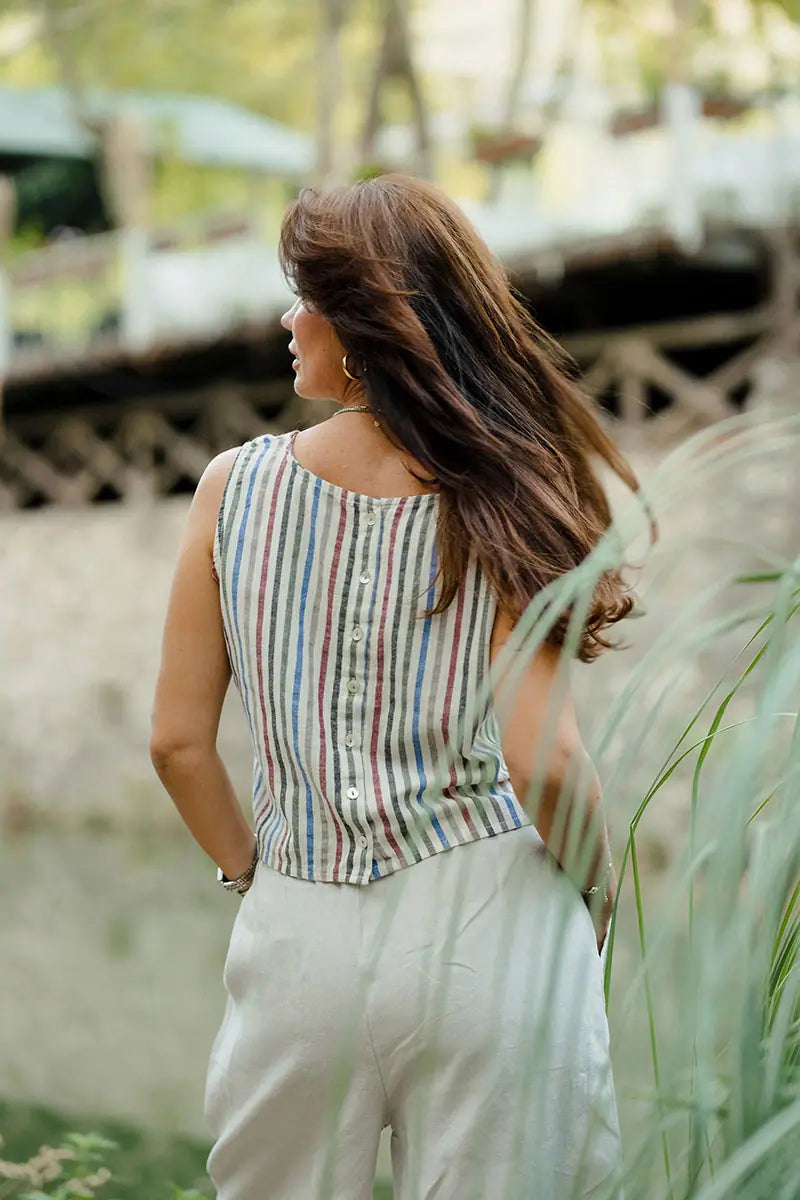 Back view of sleeveless striped linen shell top with button-back detail