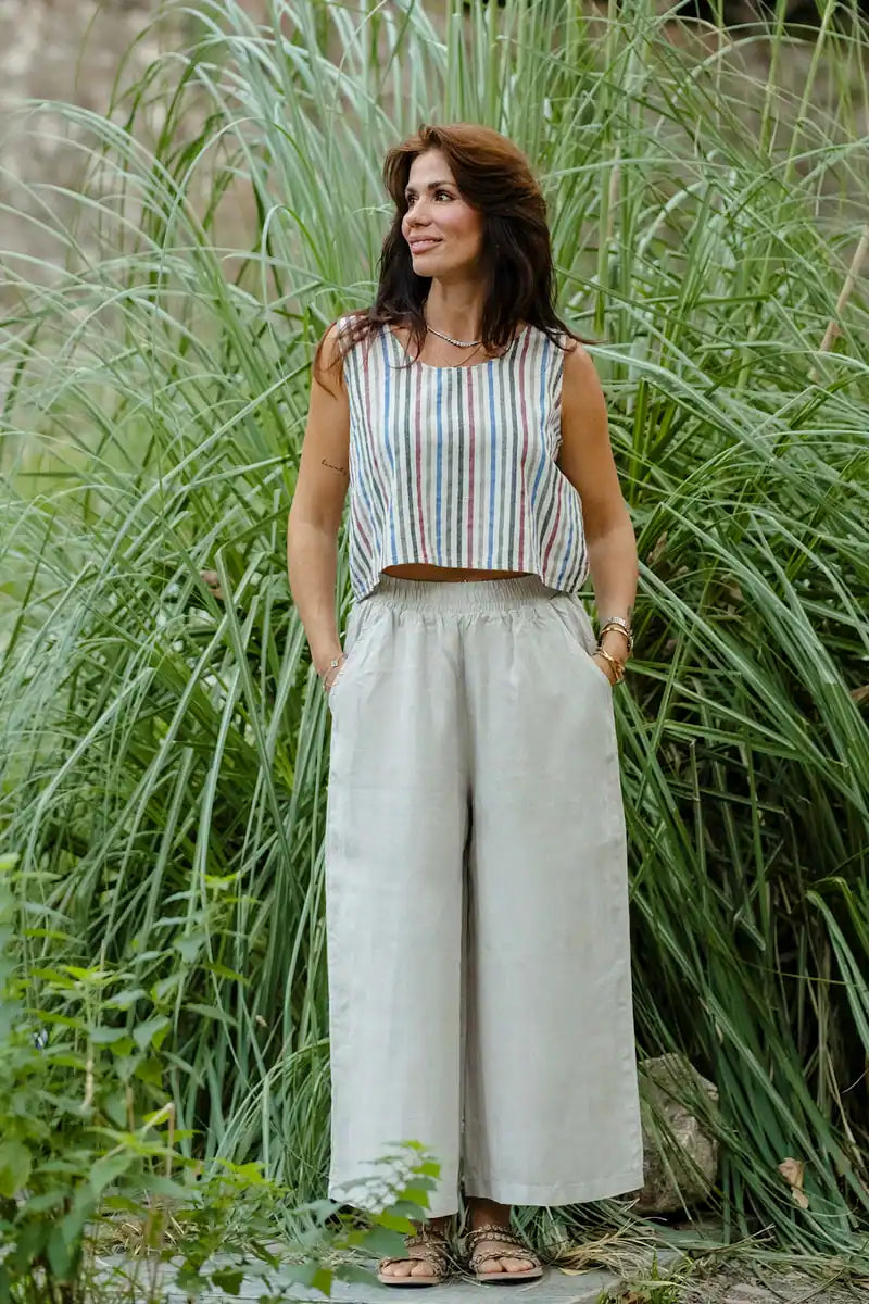Sleeveless striped linen shell top styled with wide-leg linen pants, front view